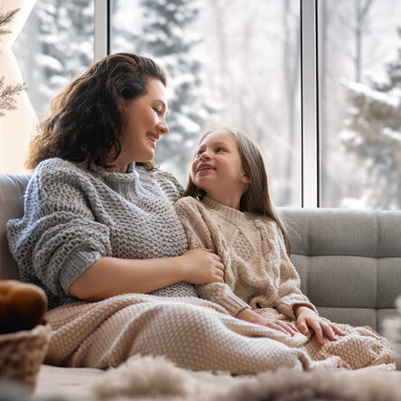 Mother and daughter enjoying home comfort