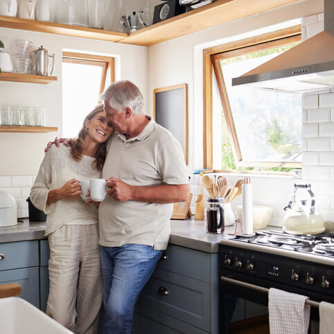 couple hugging in kitchen